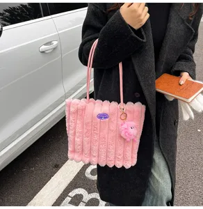 Pink fluffy tote bag for women, soft plush shoulder bag with cute fluffy pendant and slim straps.