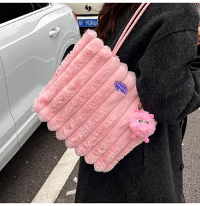 Fluffy pink pleated shoulder tote bag for women, large capacity plush handbag for daily commute.