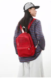 Red mesh backpack detail showing lightweight breathable fabric and comfortable straps.
