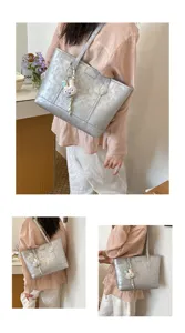 Silver large capacity tote bag for women, stylish shoulder bag for daily work or college.