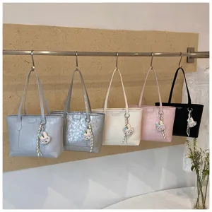 Stylish large capacity commuter tote bag with cute bunny charm for daily office and casual use.