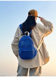 Blue mesh backpack for women, casual breathable beach daypack, lightweight summer travel bag.