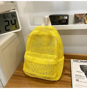 Yellow mesh backpack for women, lightweight breathable casual beach travel daypack detail.