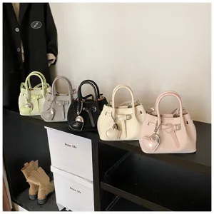 Women fashion bucket bag stylish shoulder handbag with heart pendant and pleated leather design