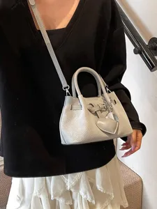 Grey woven textured bucket bag for women, stylish niche shoulder bag with pendant.