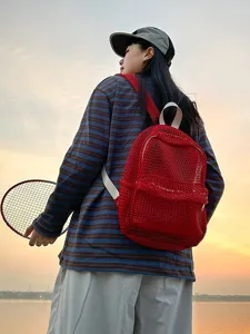 Red mesh backpack for women, lightweight transparent breathable summer travel school daypack.