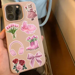 Pink aesthetic phone case decorated with cute stickers like tulips, bow, and cat for girls.