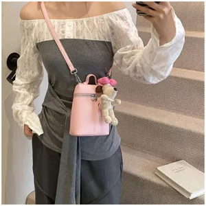 Korean style pink mini leather shoulder bag with cute dog pendant for women summer fashion.