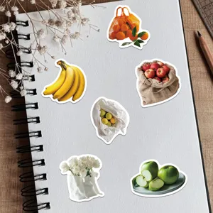 Detailed view of DIY journaling stickers featuring realistic fruit and flower designs for crafting.
