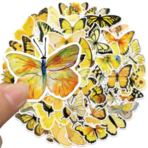 Close-up detail of aesthetic yellow butterfly stickers, watercolor design for DIY decoration.