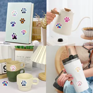Colorful paw print stickers close up showing aesthetic journaling and daily cup decor details.