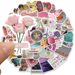 Detail view of cute pink rose sticker held by hand, showcasing Y2K retro aesthetic style.