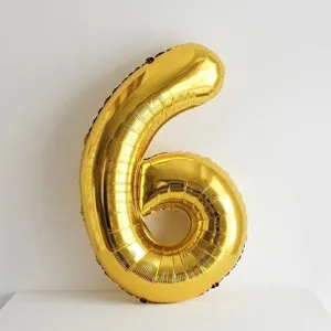 Gold number 6 foil balloon detail close-up view, perfect for birthday party decorations.