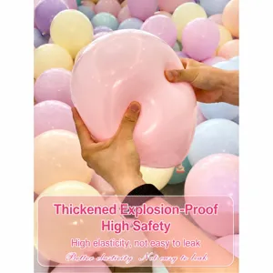 Thickened macaron latex balloon party decoration setup squeezed by hand showing high elasticity