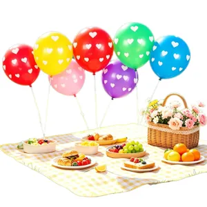 Colorful heart printed balloons set with outdoor picnic mat and fruit basket props for party decor