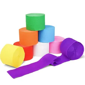 Detailed close-up shot of colorful crepe paper rolls in vivid hues for party backdrop decor.