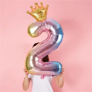 Gradient number 2 foil balloon with gold crown detail for children birthday party scene decor.
