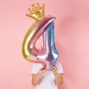 Rainbow number 4 foil balloon with gold crown for kids birthday party decoration.