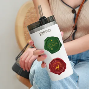 Stainless steel insulated tumbler with straw and Christmas wax seal sticker design.