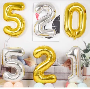 40 inch gold and silver foil number balloons scene detail display for birthday and party decor.
