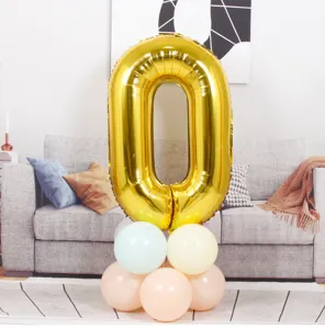 40-inch gold foil number 0 balloon with pastel latex balloon base for birthday party decor.