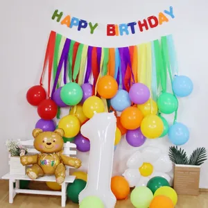 Detailed scene view of colorful crepe paper streamers used for birthday party wall decoration setup.