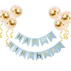 Detailed view of blue birthday banner flags and confetti balloons for party decoration.
