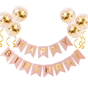 Birthday party decoration set with pink swallowtail banner and gold confetti balloons detail.