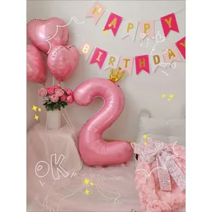 Pink number 2 foil balloon birthday party decoration set with heart balloons and banner.