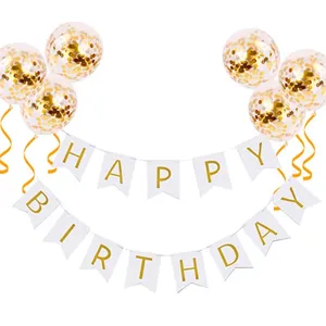 Detailed view of birthday party decoration set with gold confetti balloons and pennant banners.