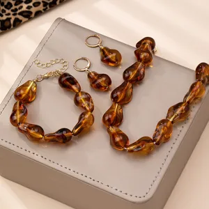 Bernstein Perlen Schmuck Set Detail, glänzende Harz Kette Armband und Ohrringe neu.
