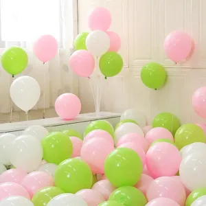Detailed view of colorful macaron pink, green, and white party balloons setup for kids event.