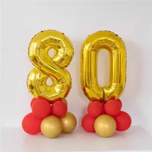 Gold number 80 foil balloons set with red and gold latex balloon bases for birthday party decor
