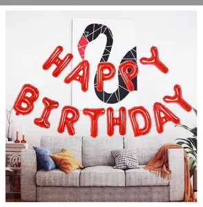 Red foil letter balloons spelling happy birthday for party background wall decoration.