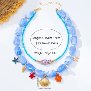 Collar de estilo océano de doble capa con cuentas azules, estrellas de mar y colgantes.