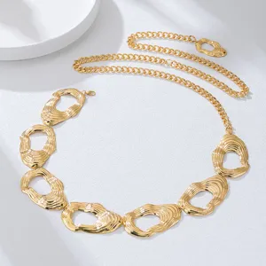 Gold metal waist chain featuring textured abstract links, perfect for bikini and dress styling.