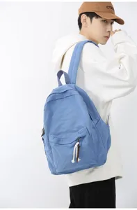 Sac à dos en toile de couleur unie pour le quotidien, l'école et les voyages, spacieux et durable.