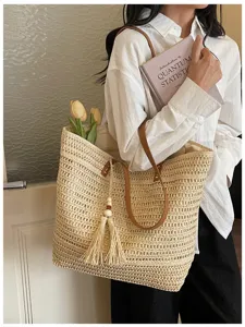 Vista dettagliata della borsa tote in paglia intrecciata, borsa a spalla stile minimalista.