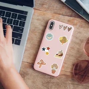 Boho aesthetic phone case with cute artistic stickers lifestyle display detail shot