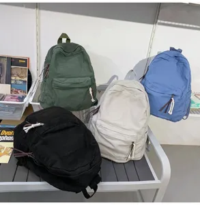 Sac à dos en toile unie, cartable de style collège décontracté pour femmes et voyage.