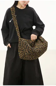 Leopard print canvas crossbody bag casual large capacity shoulder bag for women commuter daily.