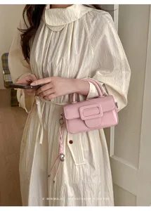 Chic pink shoulder bag for women, trendy square buckle design, premium retro crossbody handbag.