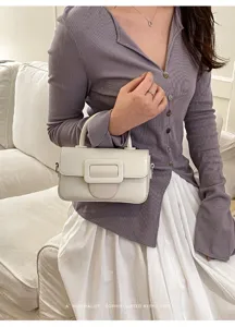 Chic minimalist white shoulder bag with elegant square buckle for women fashion daily wear.
