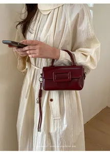 Chic retro wine red crossbody bag for women, fashionable square buckle handbag and tote.