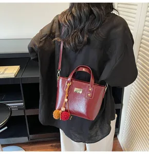 Trendy autumn winter women patent leather crossbody tote bucket bag with cute plush charms.