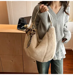 Cozy beige faux fur shoulder bag detail, fluffy hobo handbag with leopard heart charm.