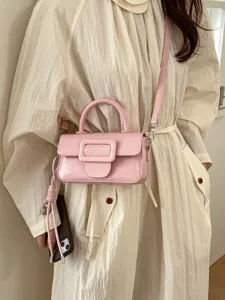 Chic pink top-handle crossbody bag for women, stylish small square purse with buckle.