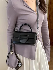 Chic black patent leather crossbody bag for women, stylish top handle small square handbag.