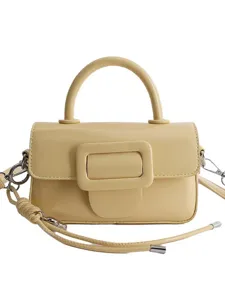 Yellow top handle crossbody bag for women, stylish square shoulder handbag with large buckle.