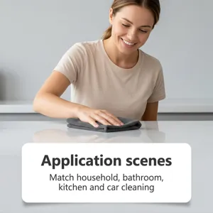 Detailed view of dark grey microfiber cleaning cloth in home use, high absorbency for kitchen.